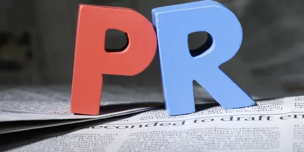 depositphotos_45620343-stock-photo-word-pr-on-newspaper